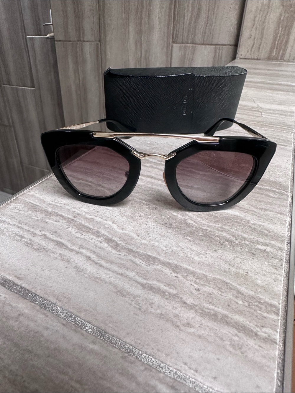 Prada Black Cat-Eye Sunglasses with Gold Bridge